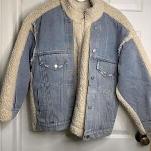 Oversized blue denim jacket with cream sherpa trim and back